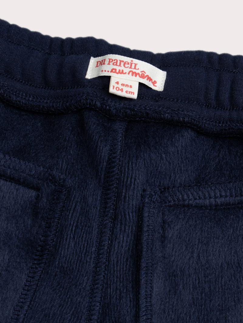 Pantalones azules doblados cálidos