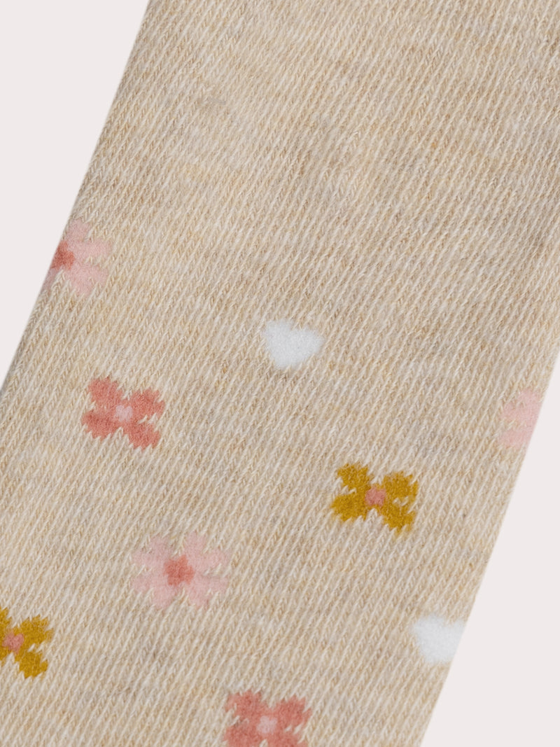 Medias beige oscuras con motivo flores para bebé niña