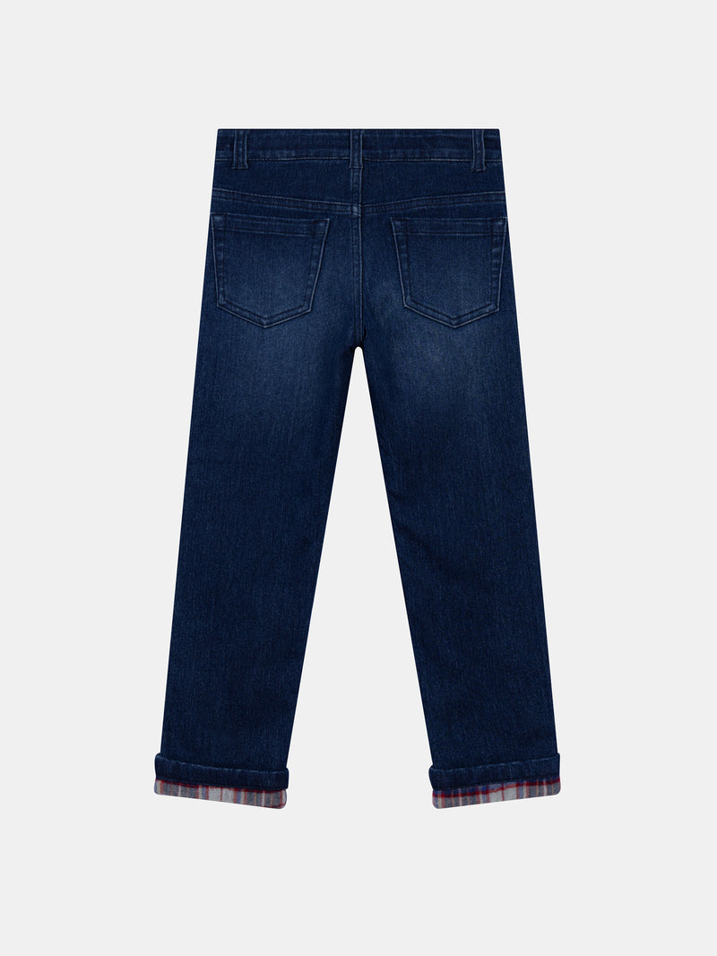 Jean de denim azul con bolsillos para niño