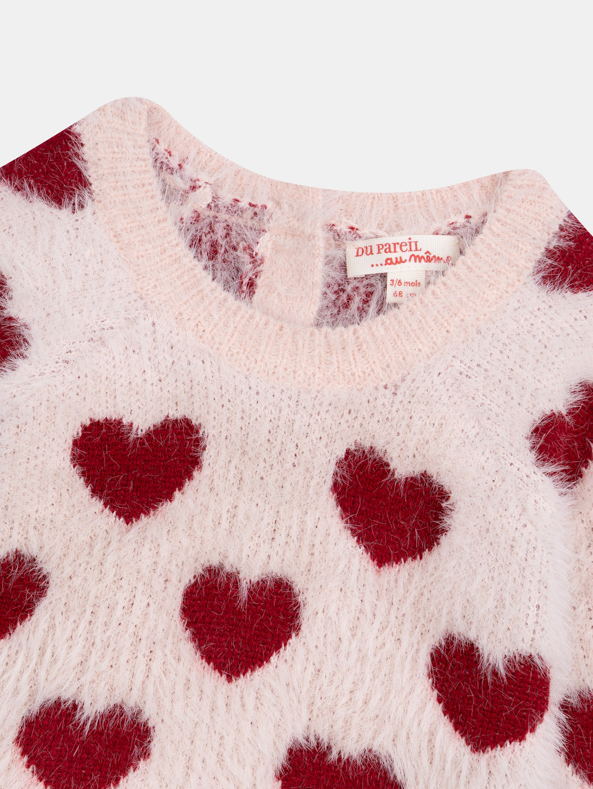 Suéter rosa tiza con patrón de corazones para niña bebé