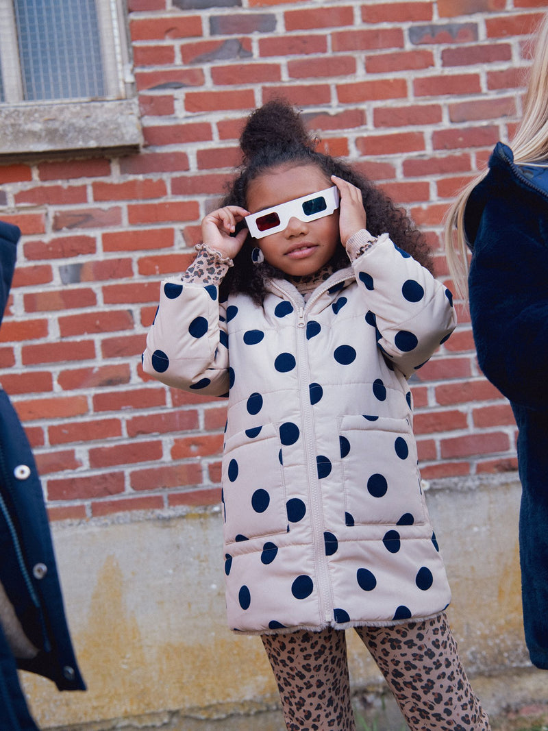 Parka reversible con lunares para niña