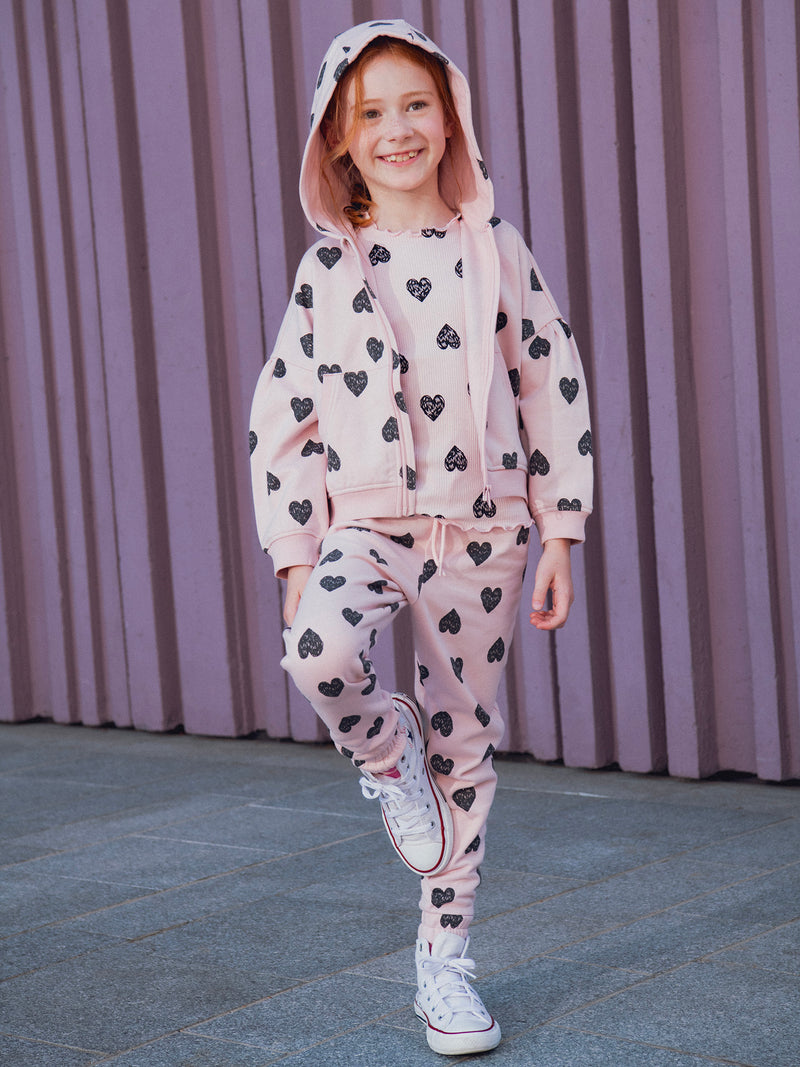Pantalones de jogging rosas con estampado de corazones para niñas