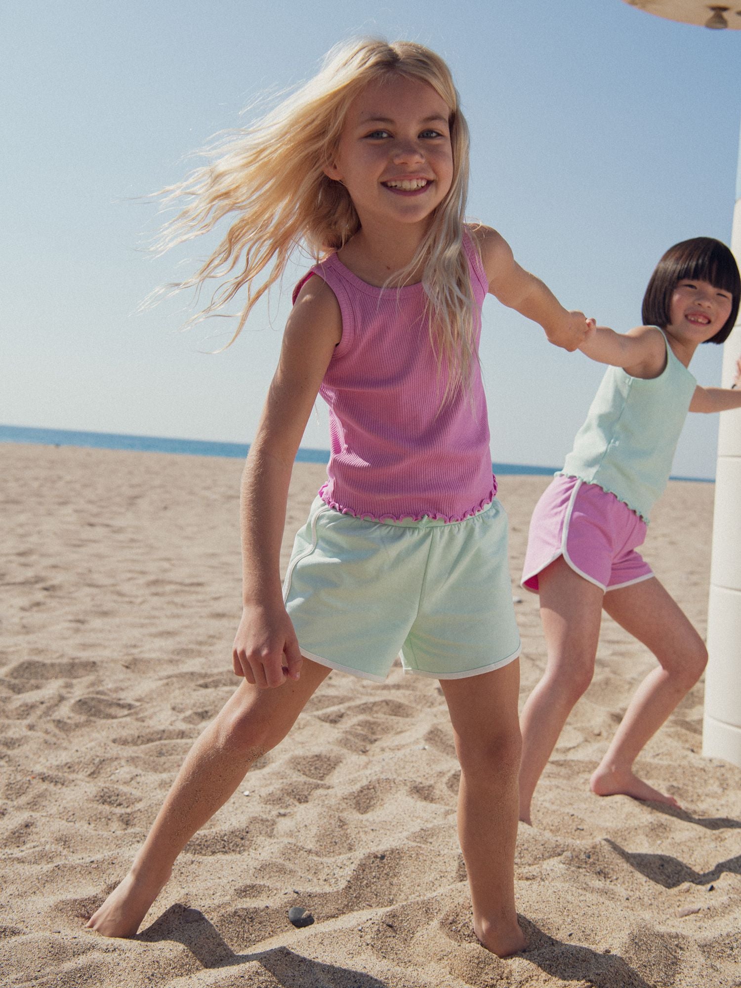 Débardeur uni rose en côte pour fille