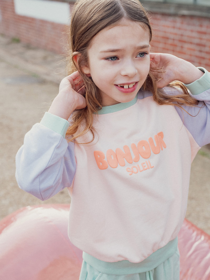 Superior de jogging colo block animación hola para niña