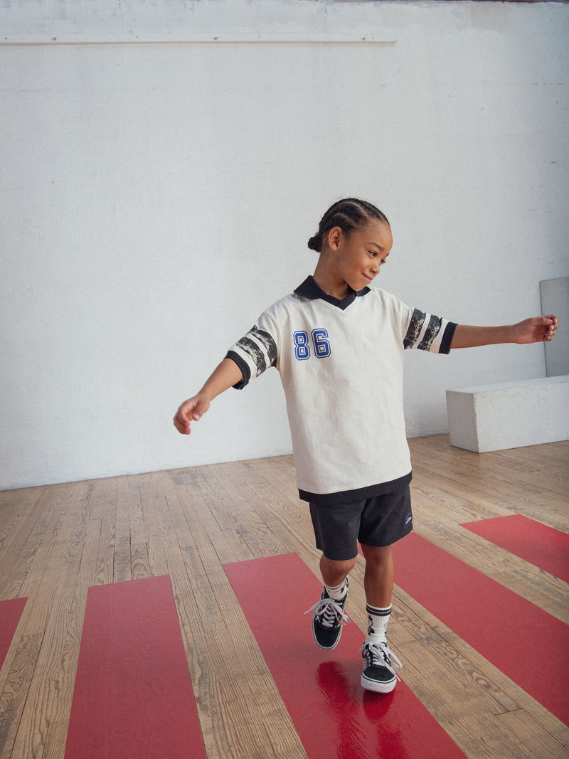 Camiseta beige con animación de T-Rex para niño