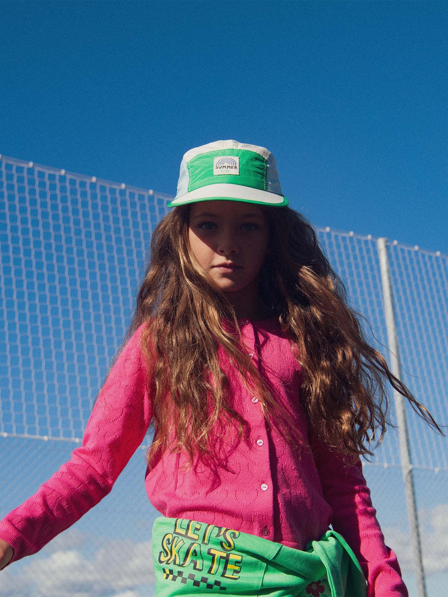 Cardigan rosa de punto con corazón para niña