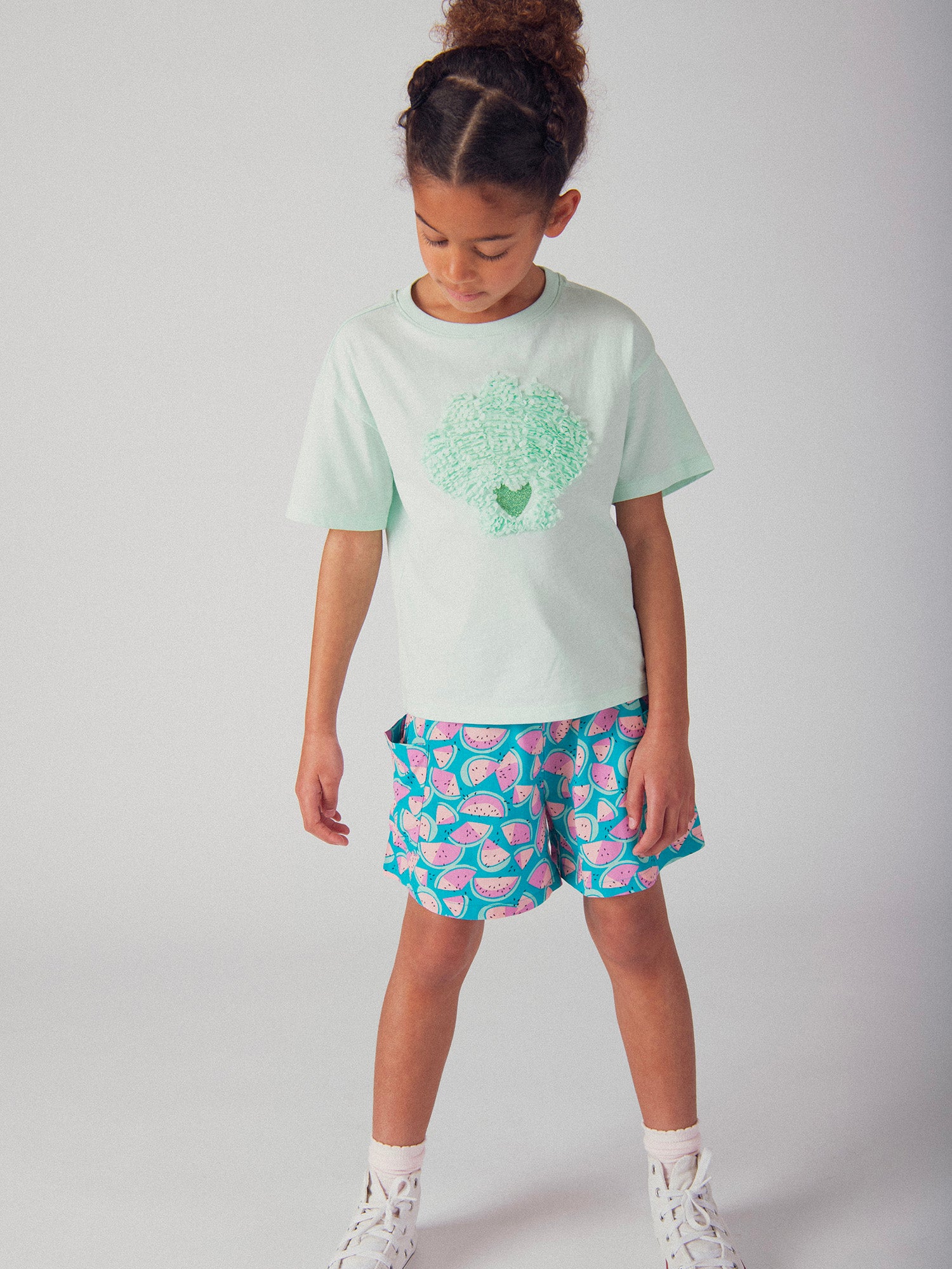 Camiseta turquesa con animación de concha 3D para niña