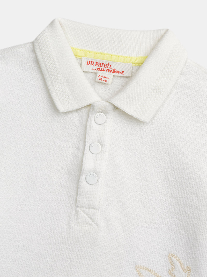 Polo ecru con bordado de palma para bebé niño