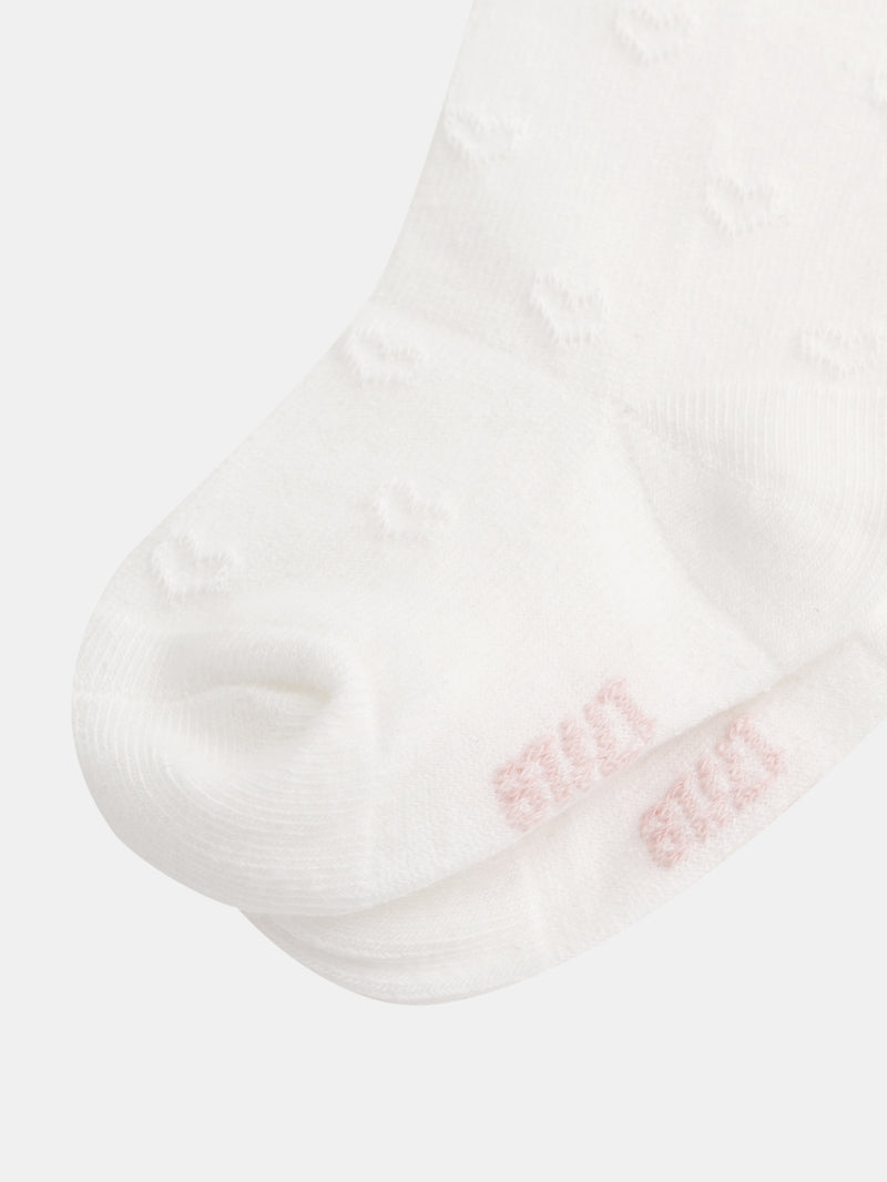 Medias ecru con corazones perforados para niñas