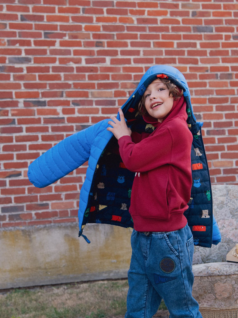 Chaqueta reversible impresa con cabezas de perro para niño
