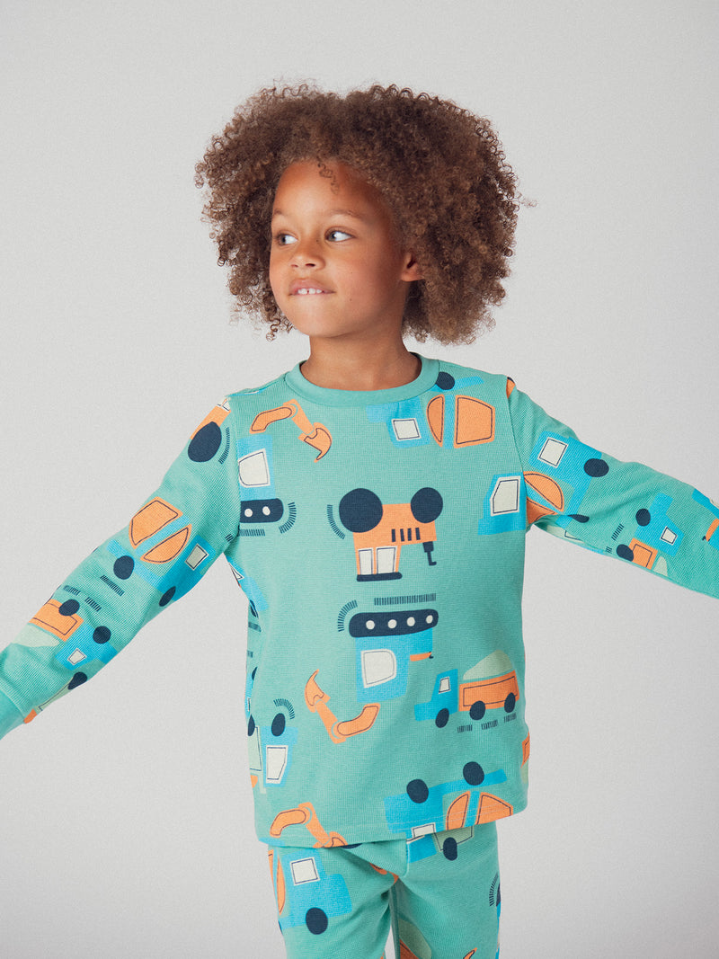 El pijama de 2 piezas verde con estampado "Construcción" para bebé niño