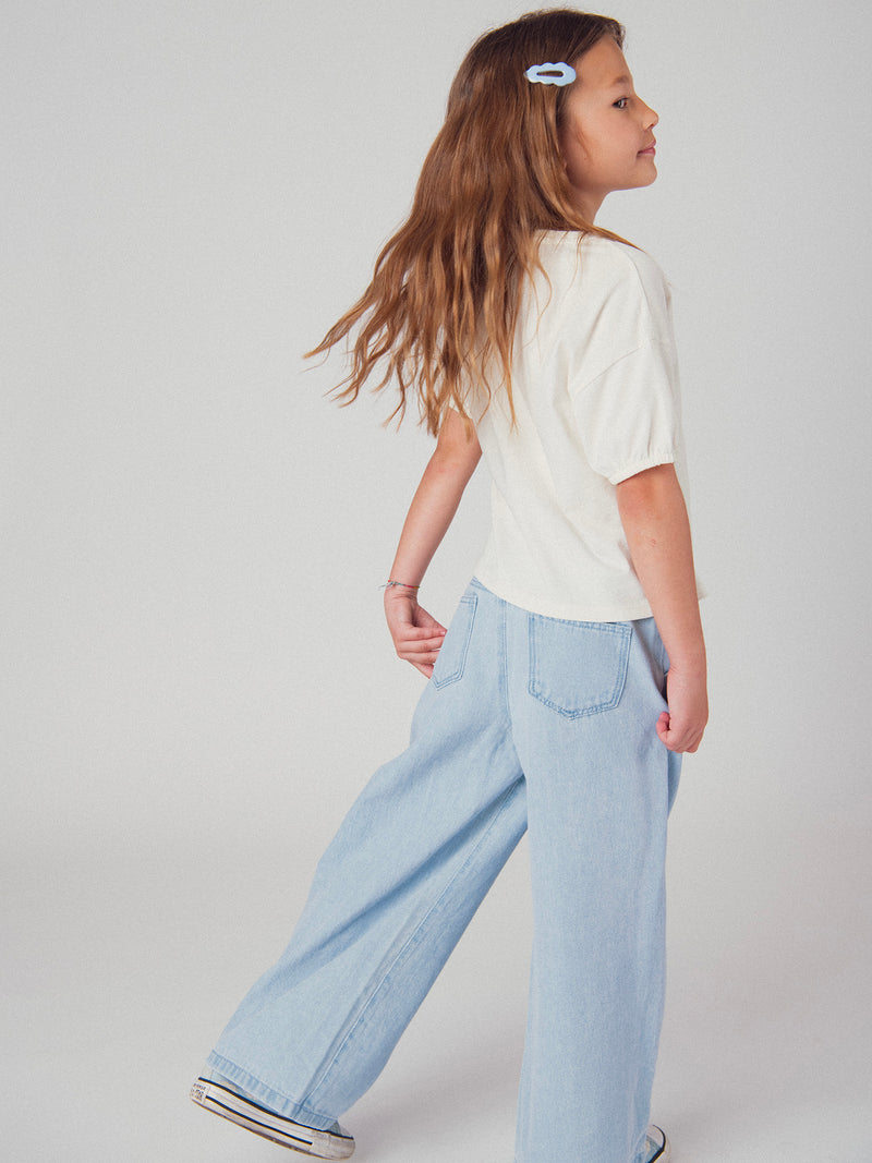 Pantalones de denim azul claro con bolsillos para niña