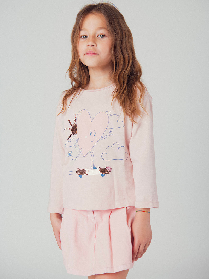 Falda corta rosa con bolsillos para niñas