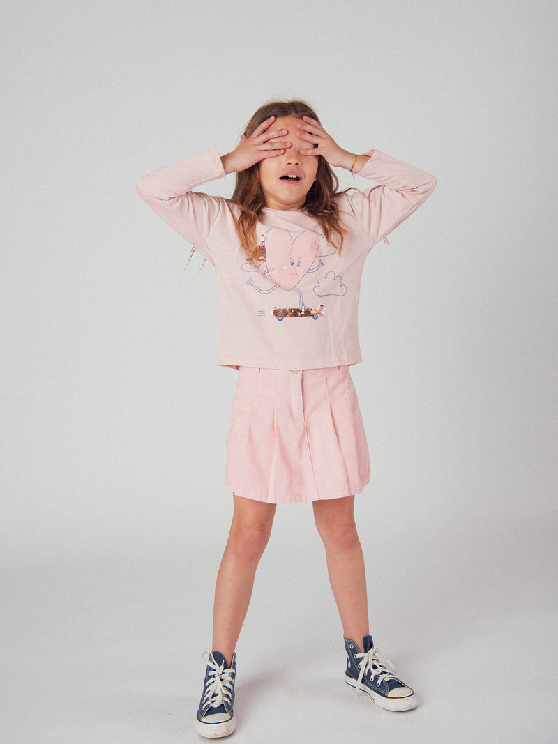 Falda corta rosa con bolsillos para niñas