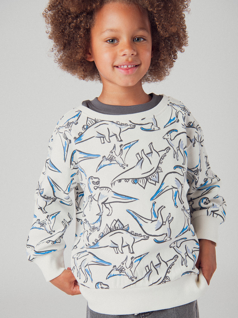 Sudadera ecru con estampado de dinosaurios para niños