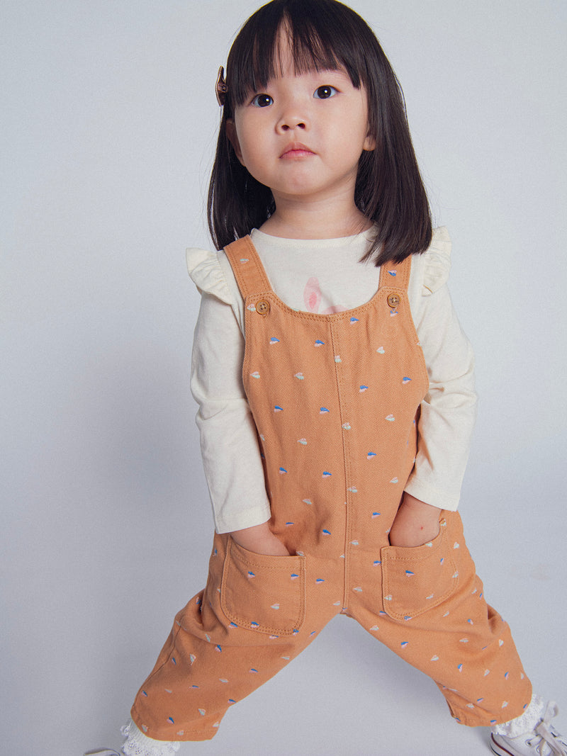 Camiseta de manga larga ecru con volantes "Conejo en patinete" para niña