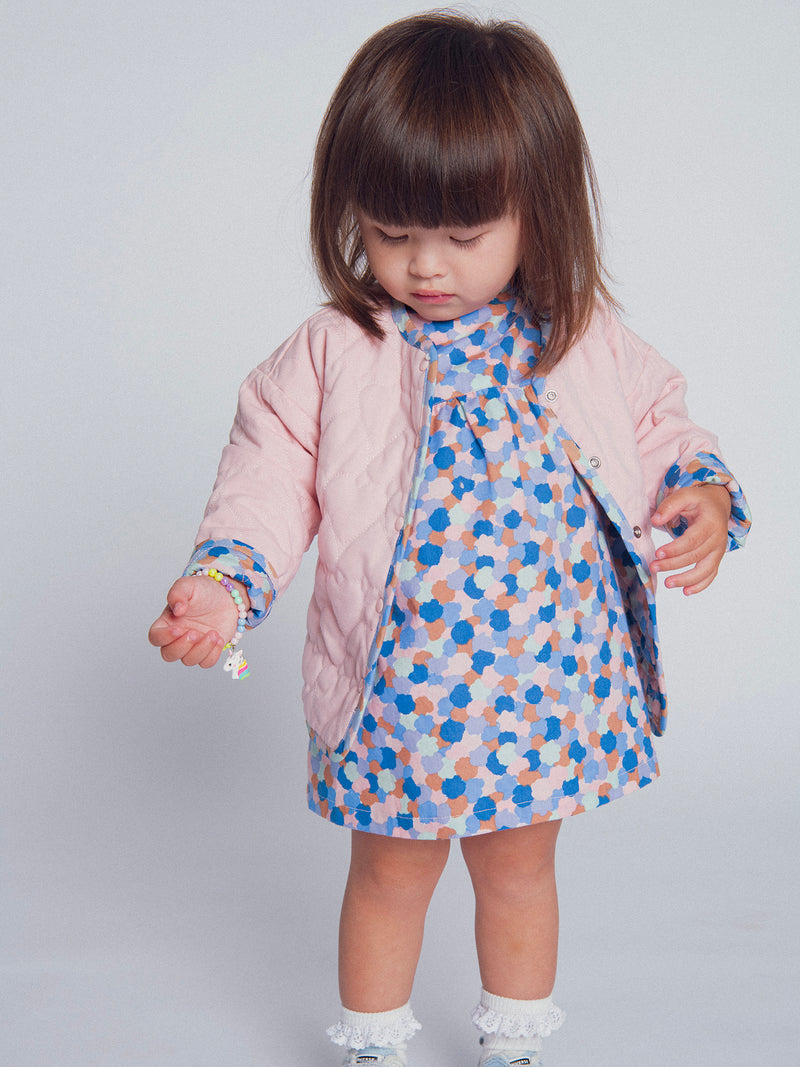Cardigan reversible acolchado rosa con corazones para bebé niña