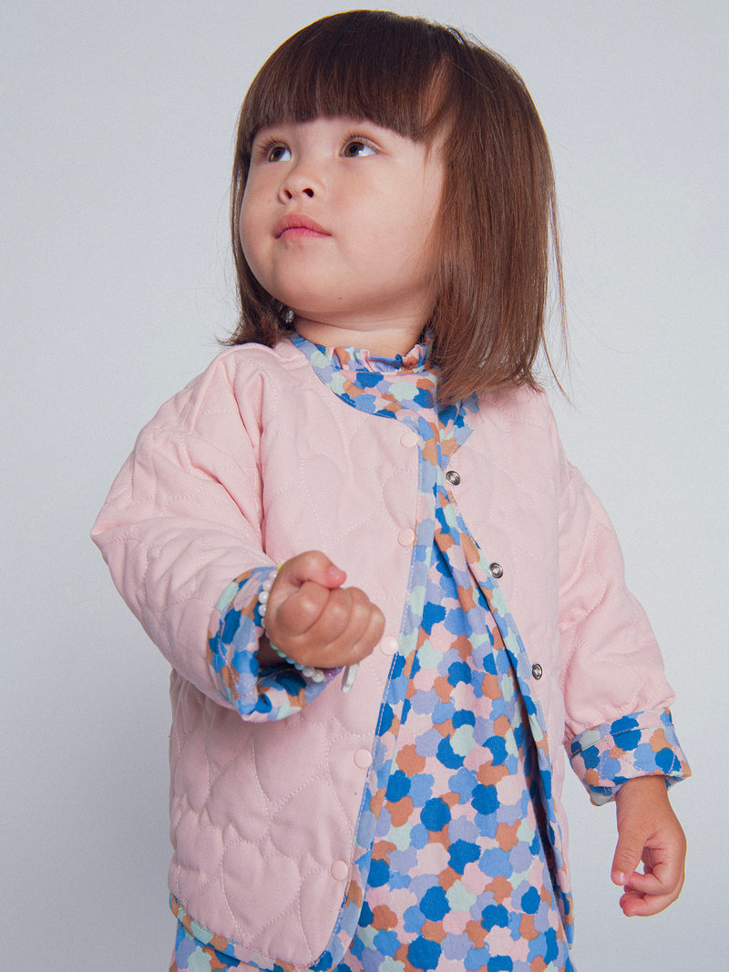 Cardigan reversible acolchado rosa con corazones para bebé niña