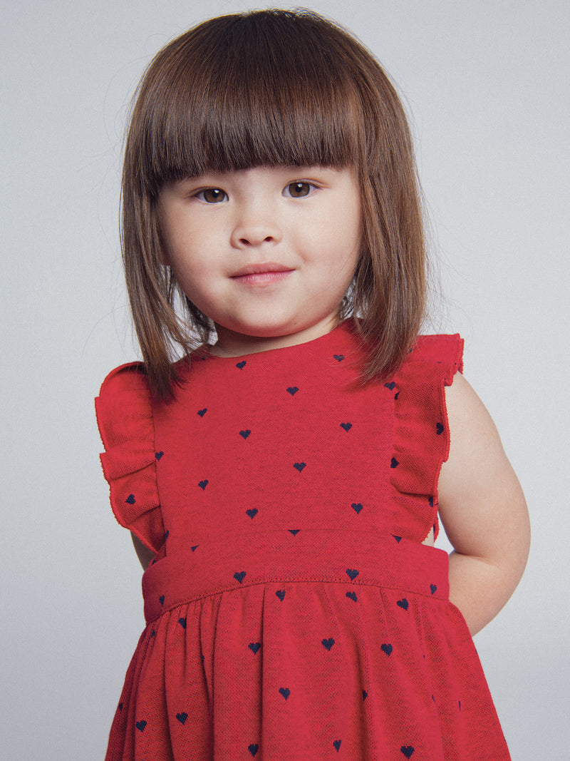 Vestido rojo de punto con estampado de corazones para niña