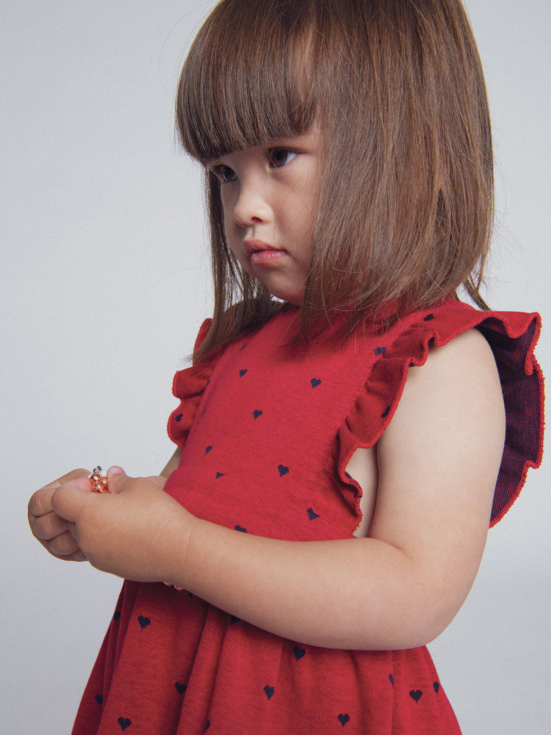 Vestido rojo de punto con estampado de corazones para niña