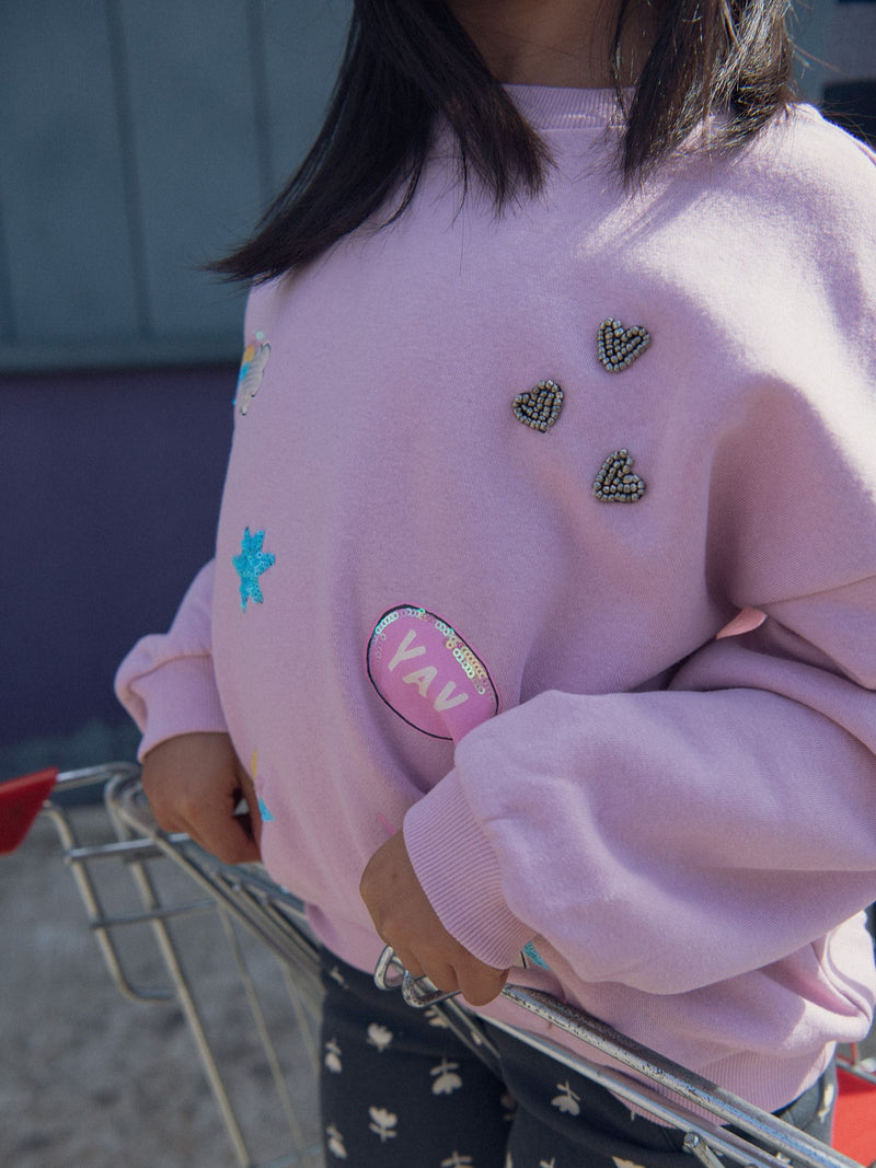Sudadera rosa con animaciones de fantasía