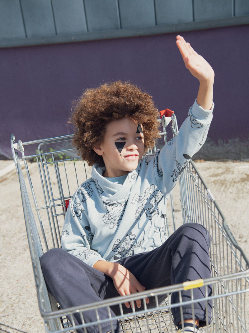 Sudadera verde con cuello alto y estampado de yeti para niños