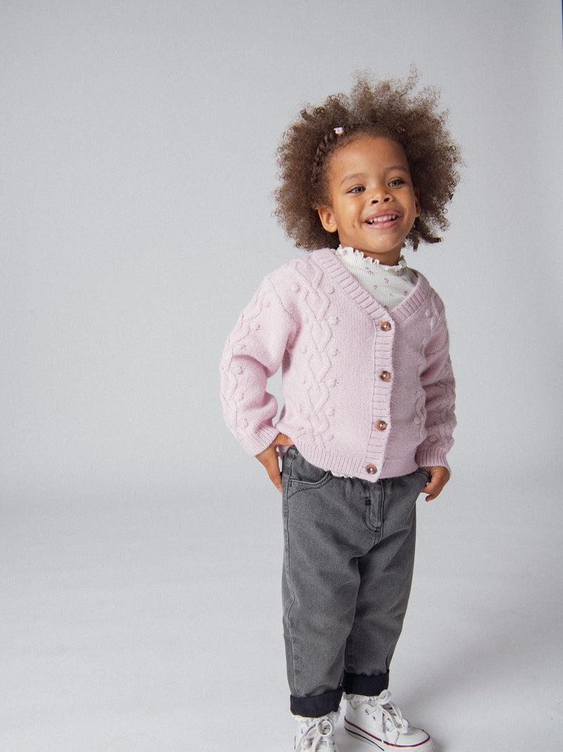 Cardigan de punto retorcido rosa para niña