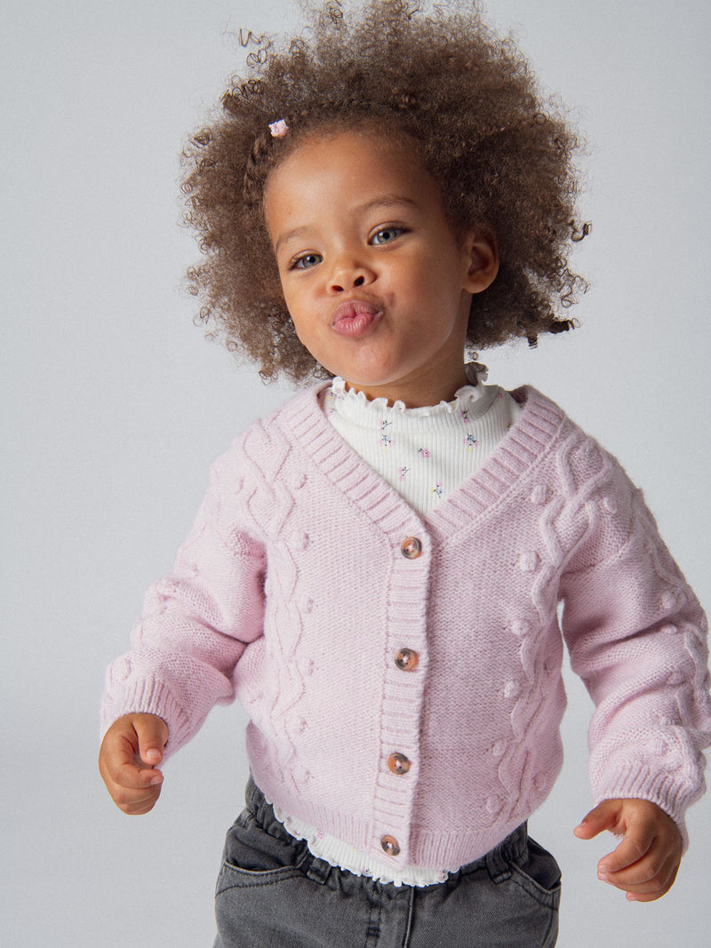 Cardigan de punto retorcido rosa para niña