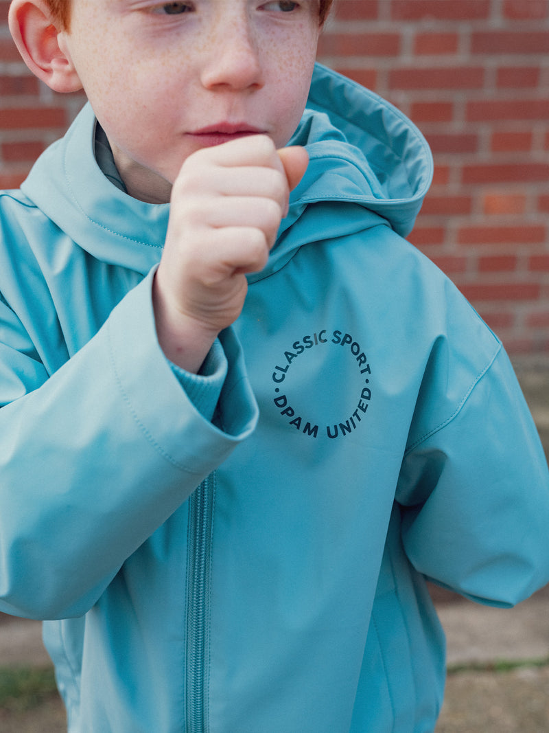 Impermeable azul con capucha para niño
