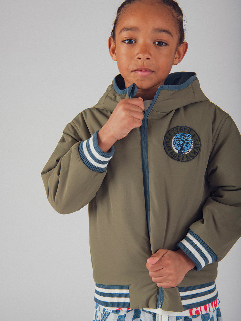 Chaqueta reversible azul y verde para niños