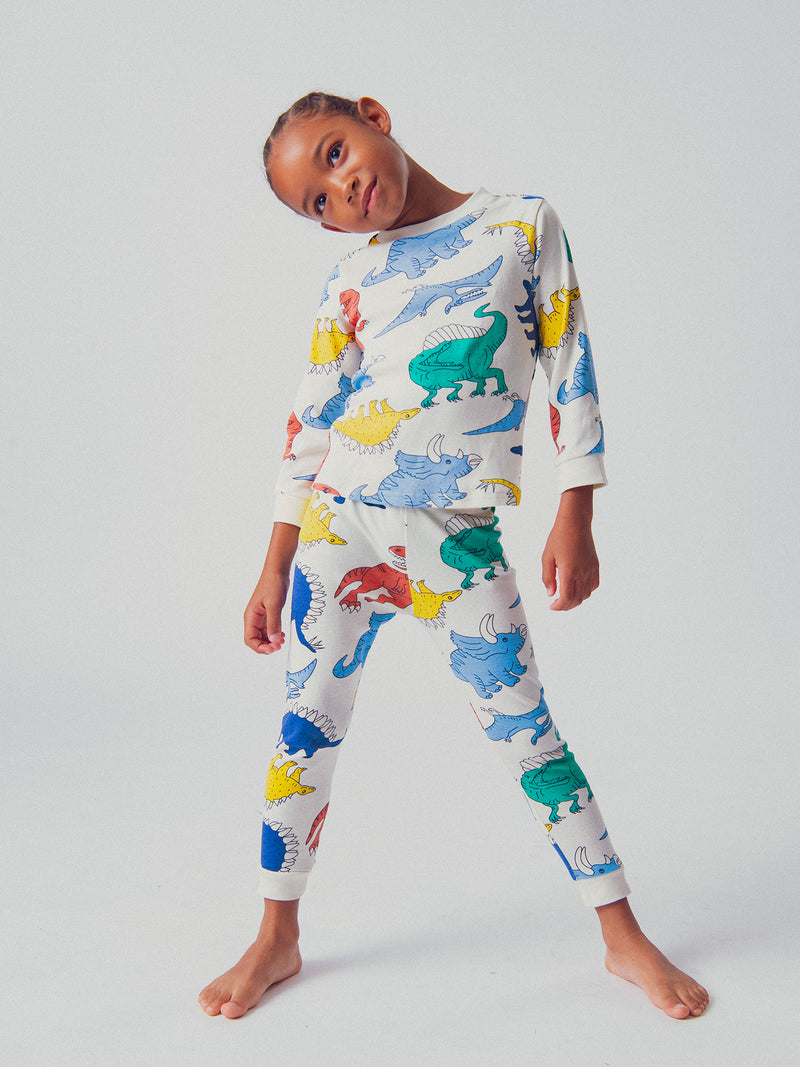 Pijama ecru con imágenes de dinosaurios para niños