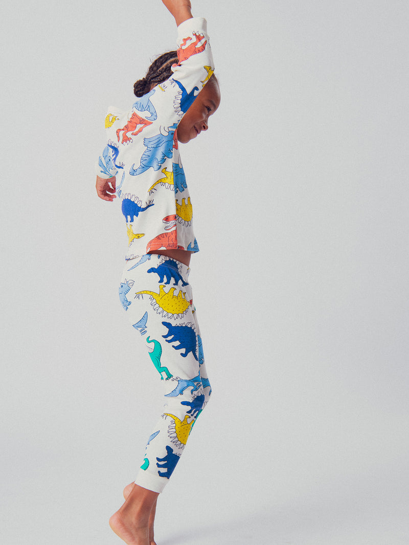 Pijama ecru con imágenes de dinosaurios para niños