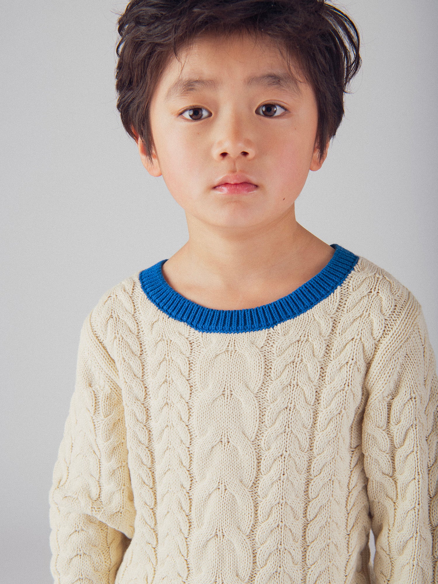 Pull beige a détails bleu pour garçon