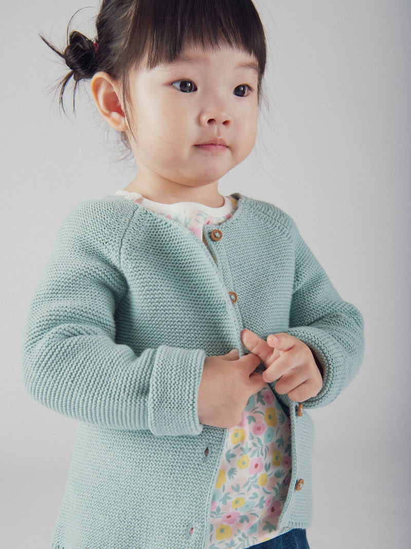 Cardigan de tricot azul powder para bebé niña