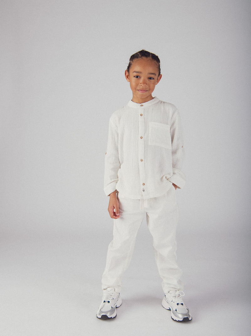 Camisa ecru con bolsillo para niños