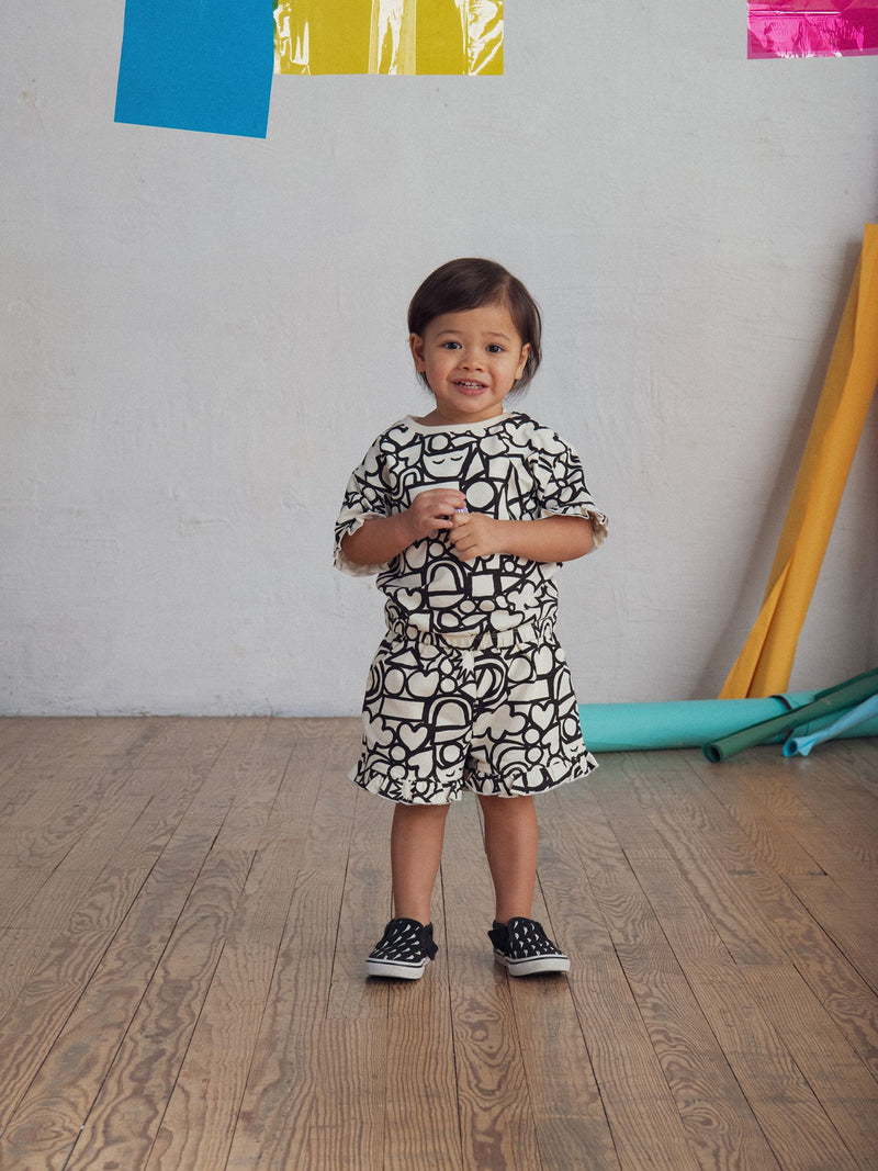 Conjunto de camiseta y pantalones cortos con estampado integral "GRAPHIC" para niña