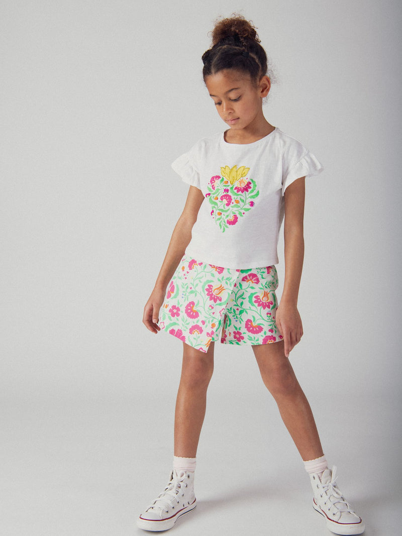 Pantalones cortos blancos con estampado floral para niñas