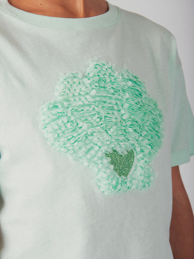 Camiseta turquesa con animación de concha 3D para niña