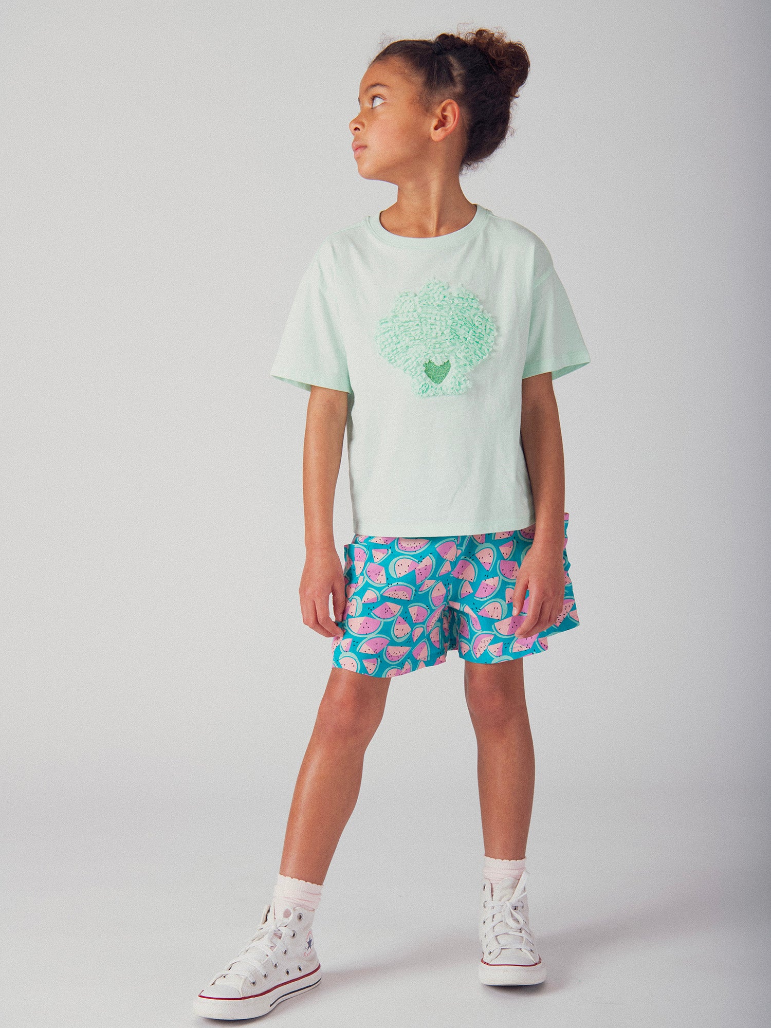 Camiseta turquesa con animación de concha 3D para niña