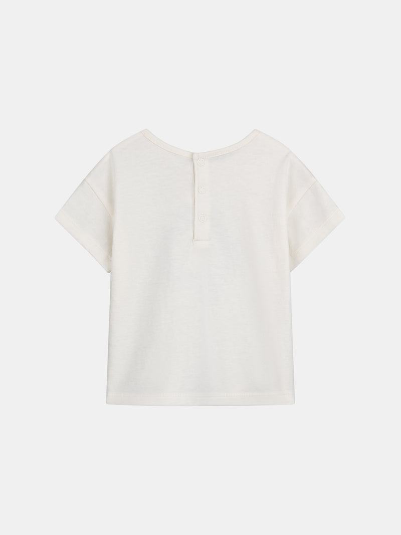 Camiseta ecru con motivo de flor para bebé niña