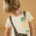 Camiseta crema con estampado de jirafa